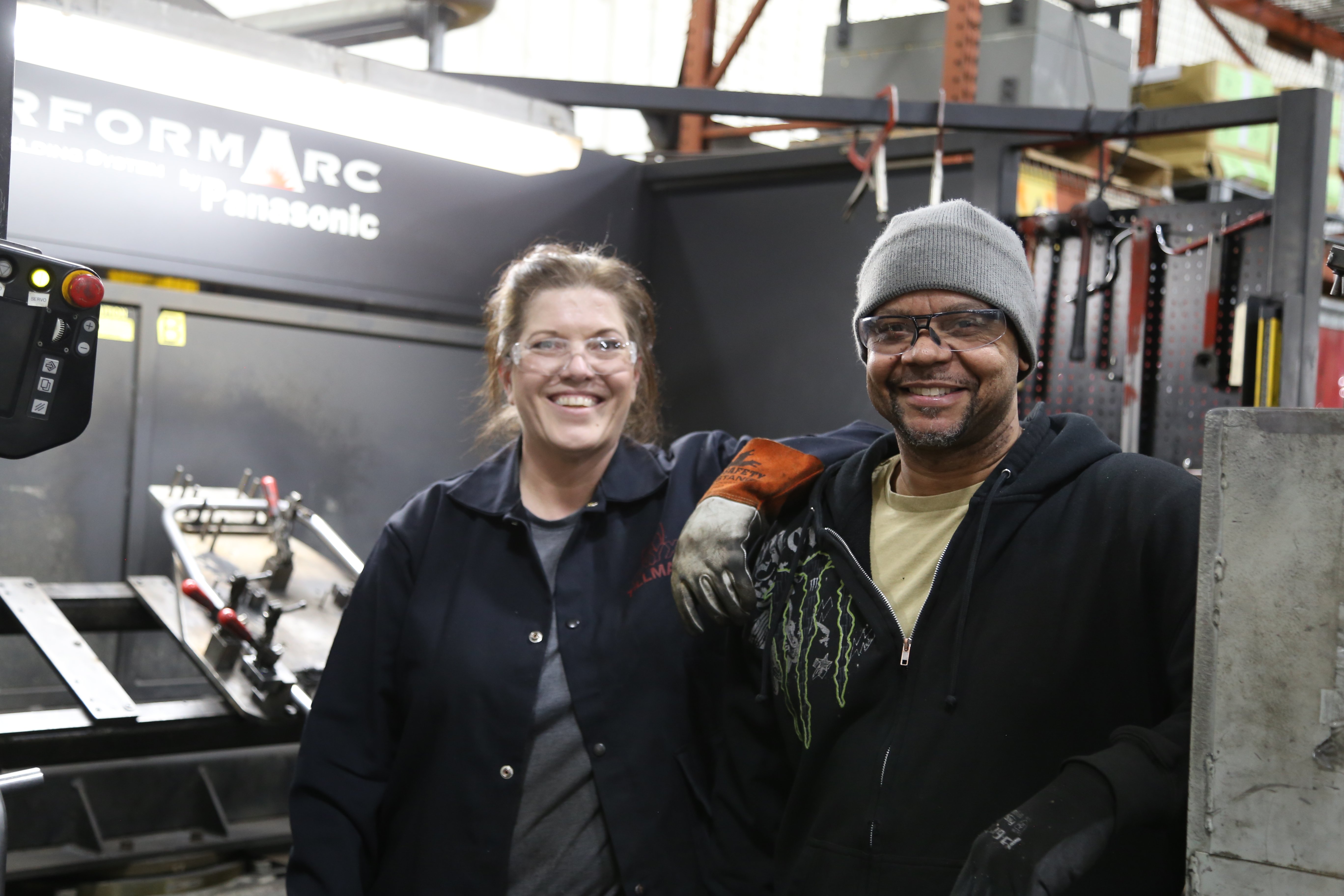 Welding employees in manufacturing plant