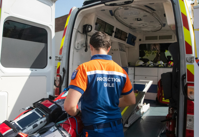 Attendant looking at ambulance carrier